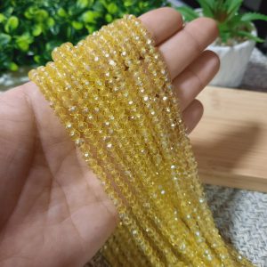 Cristal rondel color amarillo pálido traslucido - 4mm