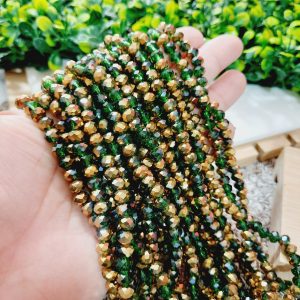 (1005-0119) Cristal rondel verde oscuro traslucido y dorado 6mm