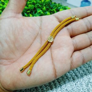 Pulsera de cordón amarillo mostaza